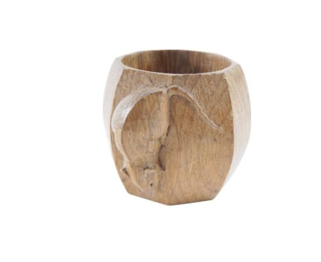 A Robert Mouseman Thompson carved oak octagonal napkin ring, 6cm wide. 