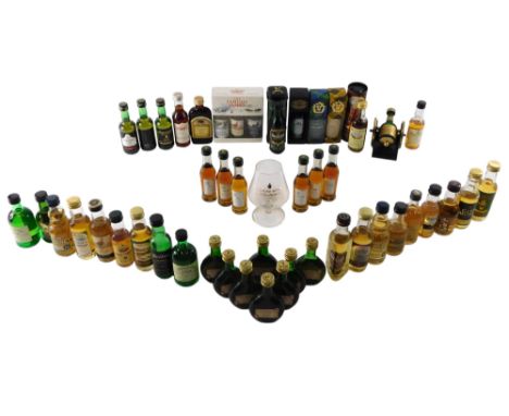 A collection of miniature bottles of whisky, some miniature bottles of Armagnac, and two Courvoisier samples with glass, etc.