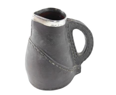 A Doulton Lambeth pottery model of a blackjack jug, with silver mount, 16cm high.