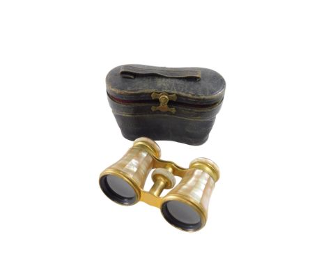 A pair of mother of pearl and gilt metal opera glasses, stamped Lamaire, F Paris, the box stamped C. Beuleke Bremen. 