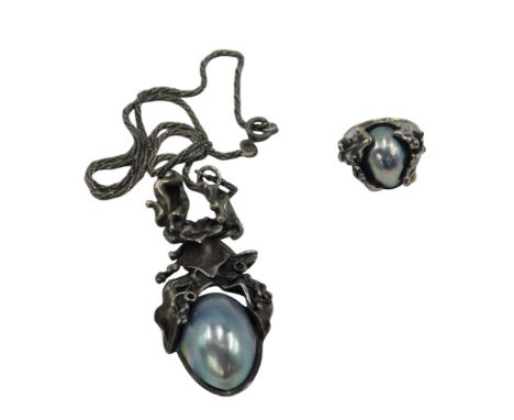 A silver and Osmena blue maybe pearl necklace on chain, together with a matching ring.