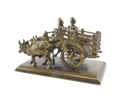 An Indian brass model of a cart being pulled by oxen, on a rectangular base, stamped to underside School of Art Jaipur, 16cm 