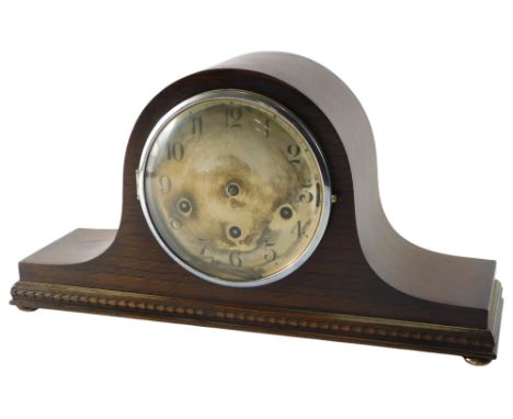 An early 20thC oak cased Napoleon's hat shaped mantel clock, with silvered dial, 42cm wide.