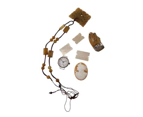A silver mounted paw brooch, carved jade necklace, silver cased wristwatch, Chinese mother of pearl gaming tokens, and a shel