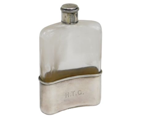 A Victorian glass and silver hip flask, engraved to the base H.T.G, the reverse with a bird crest, London 1889, the silver ba
