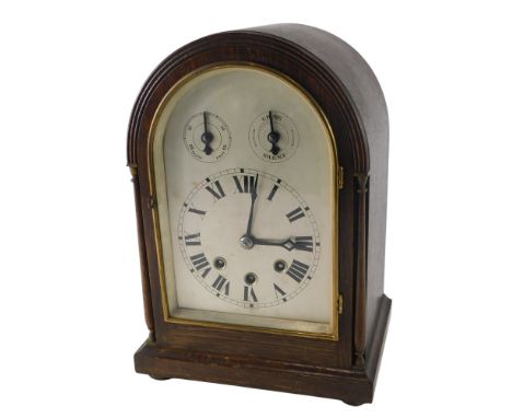 An early 20thC German oak cased mantel clock, with Westminster chime, subsidiary dials stamped Made in Wurtemberg, 34cm high.