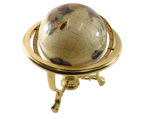 A lacquered brass table globe, inset with semi-precious stones, etc., in original box, 34cm high, 30cm wide. 