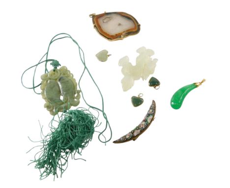 A jade double fish pendant, jade dragon, further jade set jewellery, crescent shaped brooch, and a sliced agate pendant.
