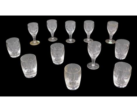 A set of six Stewart crystal small wine or sherry glasses, engraved with leaves, and a matching set of tumblers, both boxed.