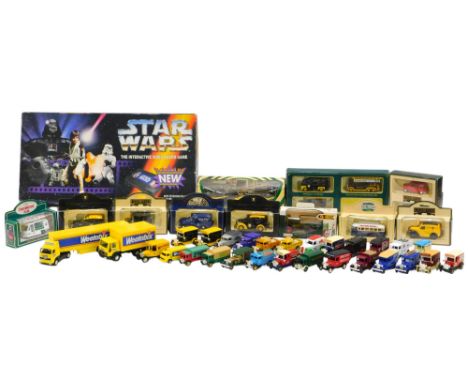 A quantity of boxed and unboxed diecast vehicles, mainly lorries or vans, and a Star Wars interactive video board game. (inco