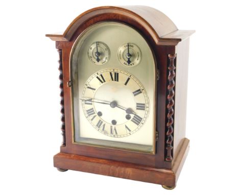 An Edwardian mahogany cased mantel clock, the silvered dial with Westminster chime, German movement, on bun feet, 34cm high. 