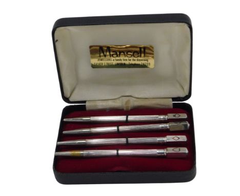 A set of four sterling silver bridge pencils, each with engine turned decoration and marked with a card suit to the pencil, s