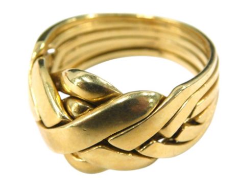 A six piece puzzle ring, yellow metal, size U, 9.2g.