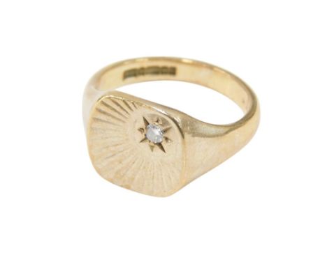 A 9ct gold gentlemens signet ring, the table diamond set in a radiating sun design, size U, 7.8g.