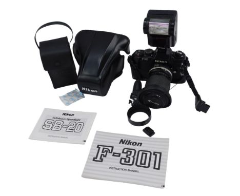 A Nikon F300 camera, with lens, and autofocus Speed Light SP20. (2) 