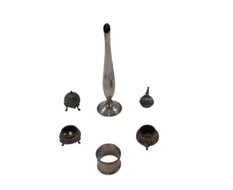 A Burmese white metal three piece cruet, a further white metal bud shaped vase, silver napkin ring, etc., 6.355oz. 
