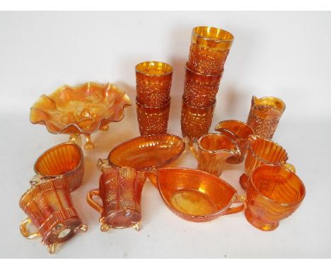 Carnival Glass - A selection of Carnival Glass to include tumblers, cups, jugs, handled bowls, a footed bowl and various.