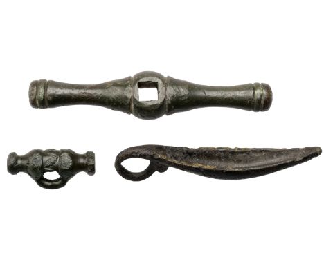 Celtic, 1st century AD, bronze artefacts (3), including dress fastener with a solid bar head and cable motifs 34mm x 15mm; ch