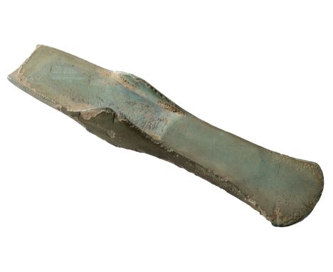 Bronze Age, c. 1800-1500 BC, a flat axe with high side flanges, curved and slightly expanded cutting edge with a bevelled fac