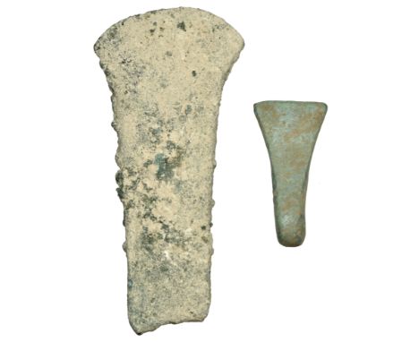 Bronze Age, c. 1800-1500 BC, a flat axe, 75mm x 34mm; expanded curved cutting edge with a bevelled face; together with votive