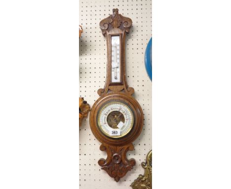 An early 20th Century oak cased banjo barometer/thermometer with visible aneroid works - thermometer scale cracked