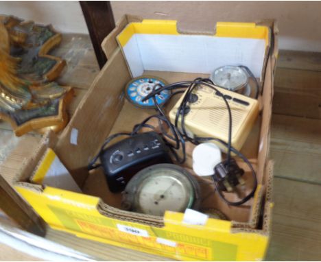 A box containing a vintage dashboard/aero compensated aneroid barometer with adjustable outer dial and silvered dial marked f