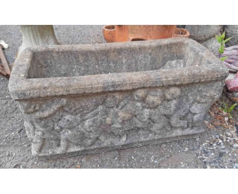 A concrete trough planter