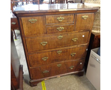 A 94cm antique mixed wood chest with burr veneer and crossbanding to top, two central drawers and flanking deep drawers over 