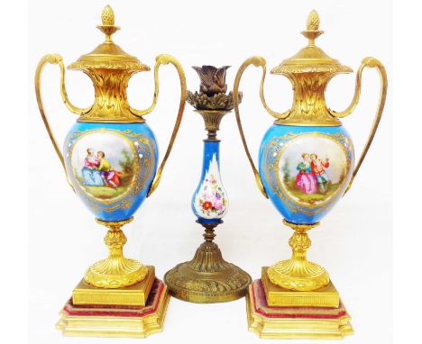 A pair of French porcelain and ormolu vases decorated in the Sevres style with central handpainted figural roundels to the fr
