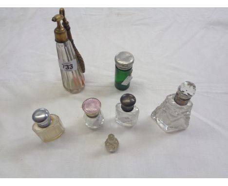 Six vintage glass scent bottles, two with silver tops