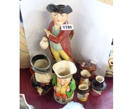 Six Toby and character jugs including Staffordshire, Burleigh ware - sold with a novelty spirit container