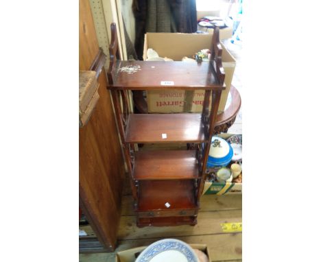 A 35cm reproduction mahogany freestanding four shelf open bookcase with decorative pierced sides and two drawers under (one m