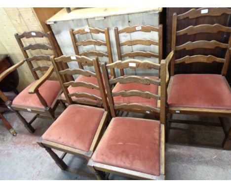 A set of six 20th Century oak framed ladder back dining chairs comprising four standard and two carvers with velour upholster