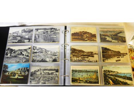 A brown ring bound album containing a collection of early 20th Century and later local interest postcards including Torquay, 