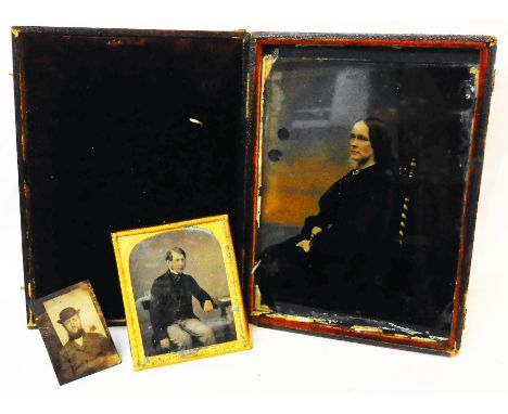 A late Victorian leather cased colour tinted photographic portrait plate of a seated woman - sold with two other miniature ph