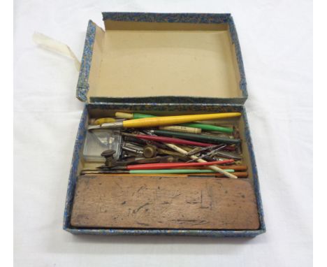 A small box containing assorted vintage drawing instruments and dip pens