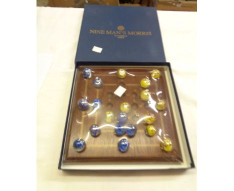 A modern House of Marbles Nine Mans Morris game with wooden board and glass marbles in original packaging