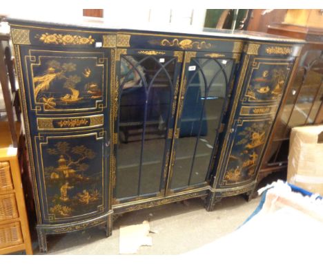 A 1.56m 1930's chinoiserie break bow front display cabinet with pair of central glazed panel doors and flanking shelves enclo