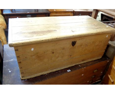 A 1.17m late Georgian pine lift-top trunk with internal candle box and original iron lock with shield shaped escutcheon - bas