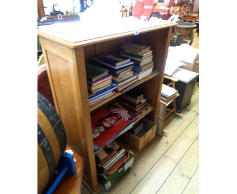 An 82cm waxed pine three shelf open bookcase, set on plinth base