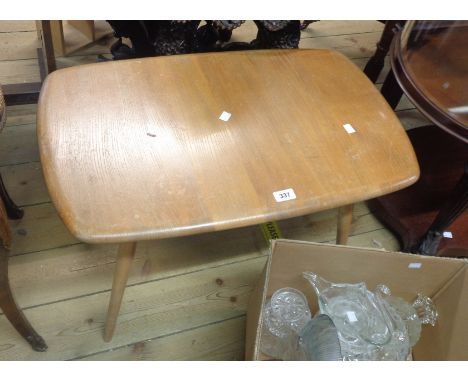 A 72cm Ercol style coffee table, set on tapered legs - worn