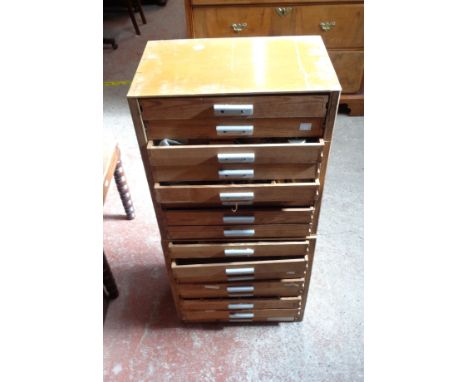 A pine and plywood two part flight of sixteen drawers containing a large collection of vintage radio and audio components and