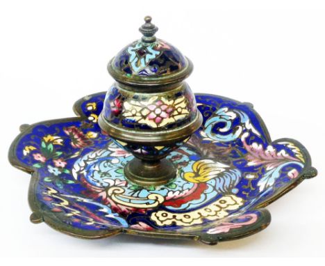 A late 19th Century champleve enamel inkwell with hinged lid and shaped tray