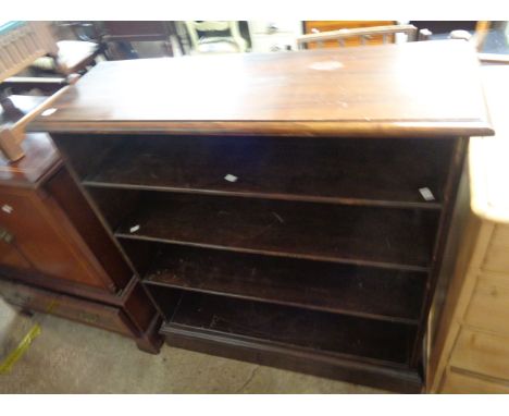 A 97cm early 20th Century stained walnut four shelf open bookcase, set on plinth base