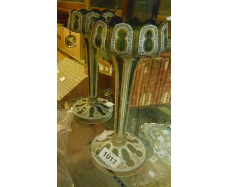 A pair of Victorian Bohemian flash cut and gilt table lustres with green glass body and white enamel casing and decorative gi