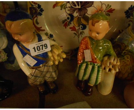 A 1930's Art Deco Austrian Goldscheider figure, depicting a young boy as a golf caddy - sold with an English Goldscheider sim