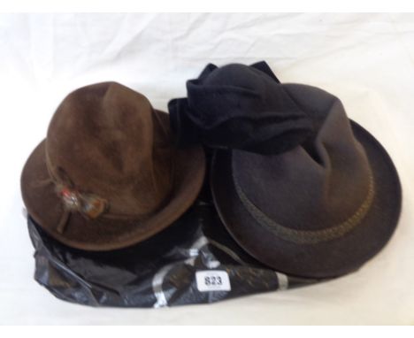 A bag containing four vintage hats