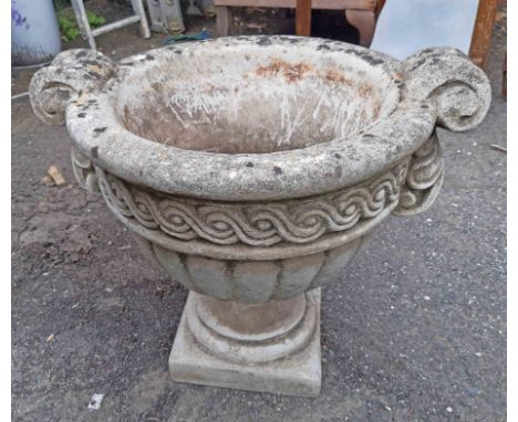 A concrete classical urn planter