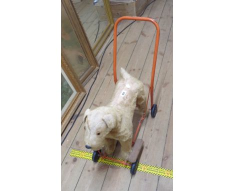 A vintage Triang push along ride on plush dog - played with condition