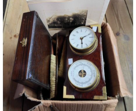 A box containing assorted collectable items including old wooden brushes, clock/barometer, etc.